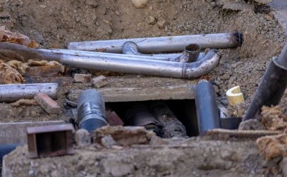 Cracked underground drain pipe requiring professional repair