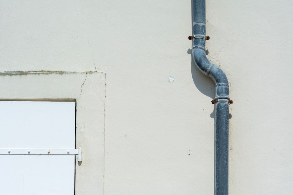 Sump pump system managing water in below-sea-level neighborhood