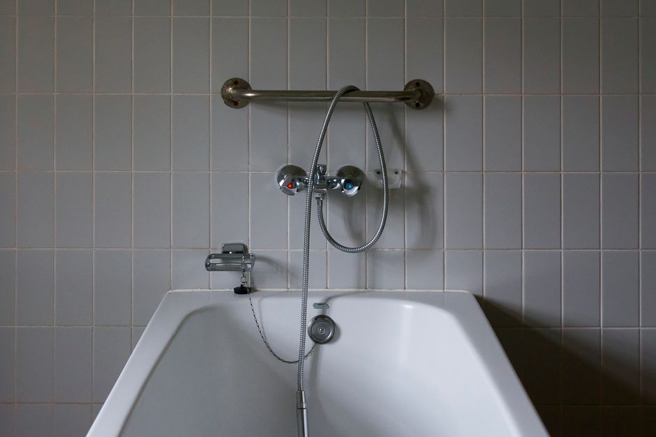 Clean bathtub in New Orleans home requiring drain maintenance