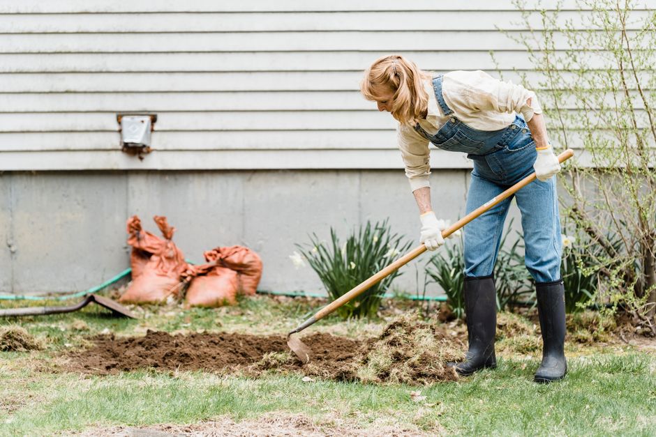 Yard regrading improving drainage around residential property