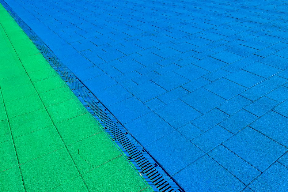 Patio with standing water needing proper drainage solution